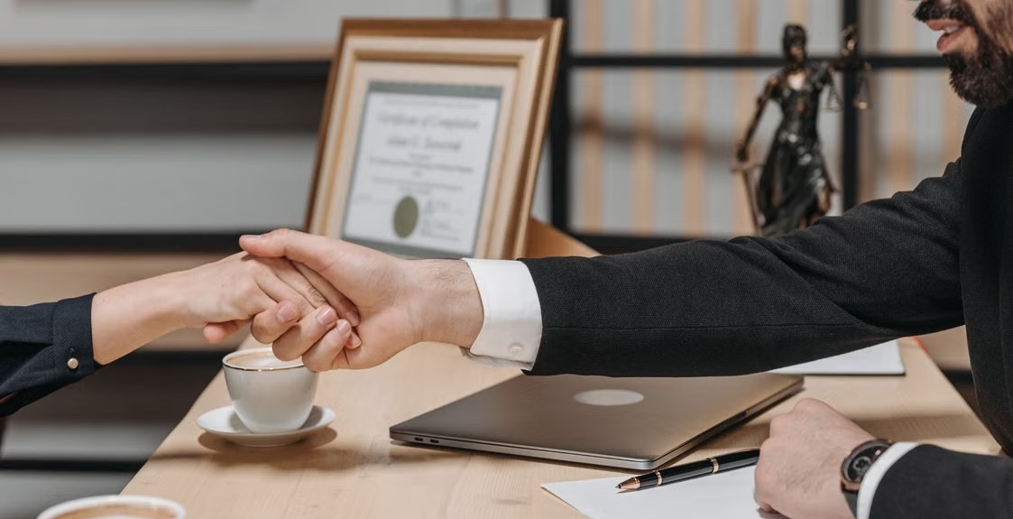 Business Owner And Agency Agreeing On Website Support Terms
