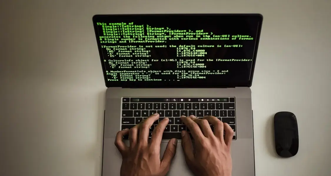 Developer Working On Software Code On Laptop
